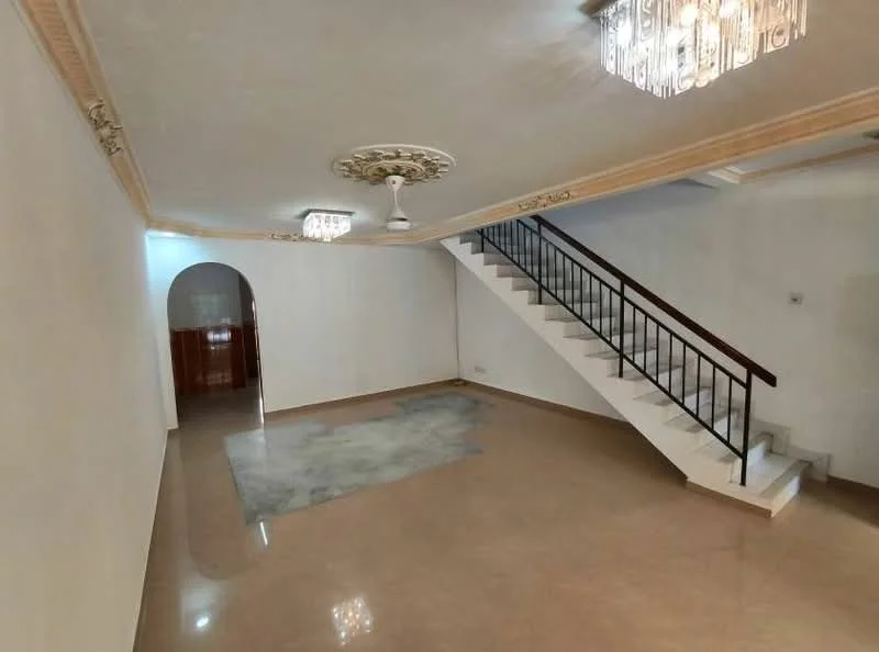 Living features: cream painted walls, polished marble flooring, tray ceiling with decorative moulding, 2 ceiling lights with crystal design, 1 ceiling fan, staircase with wooden railing, arched doorway leading to another room, area rug on floor; style: modern.