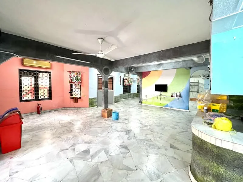 Room features: marble flooring, ceiling fan, exposed concrete beams, painted walls in pink, painted walls in green, wall-mounted TV, windows with security bars, open layout, decorative wall art, fire extinguisher, kitchenette area, storage area with shelves; style: modern.