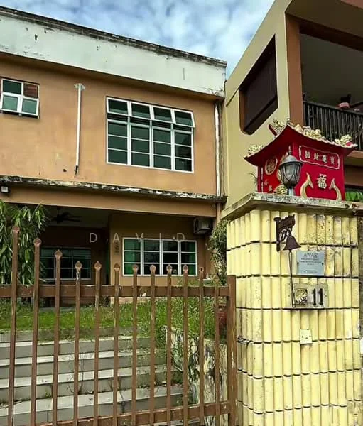Exterior type: detached bungalow; features: two-storey building, yellow painted facade, large windows with green frames, brick wall fencing, gate with house number 11, landscaped front yard with grass, decorative lantern at entrance, signage on wall; style: traditional.