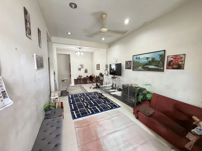 Living features: cream painted walls, white ceiling, 5-blade ceiling fan, wall-mounted TV, TV console, 2-seater fabric sofa in red, area rug with geometric pattern, decorative plants, framed artwork, coffee table, laminate flooring, light from ceiling fixtures; style: contemporary.