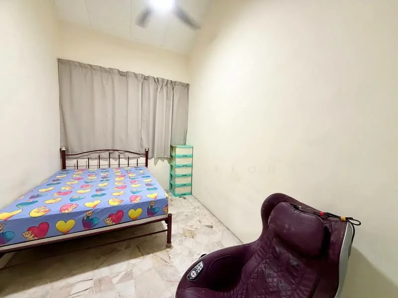 Bedroom features: single bed with colorful bedding, light-colored painted walls, curtains in neutral color, marble flooring, green storage unit, ceiling fan, armchair, window with natural light.