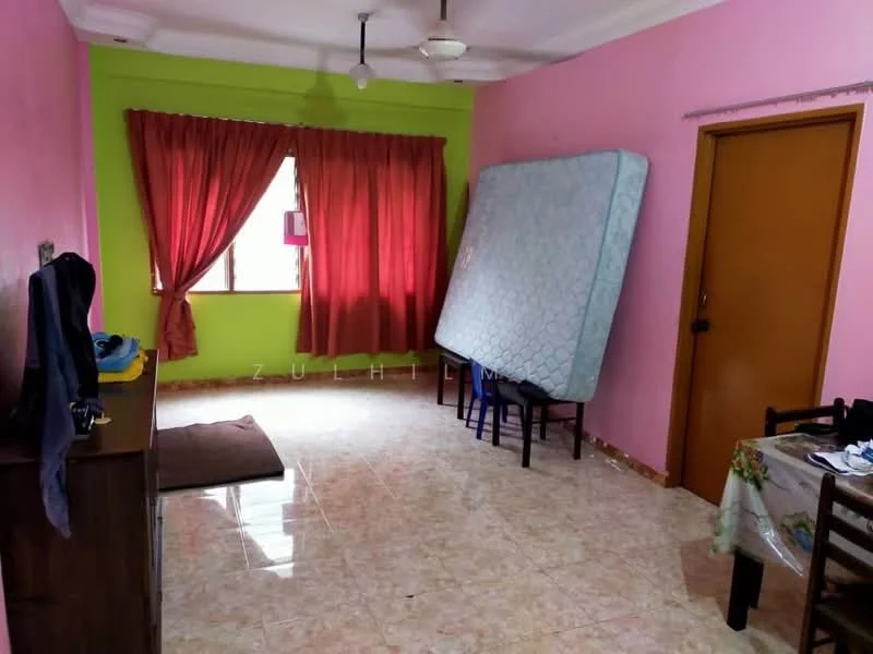 Room features: pink painted walls, green accent wall, ceramic tile flooring, ceiling fan, curtains in red, window with natural light, mattress leaning against wall, wooden door, wooden dining table, chairs, TV console.