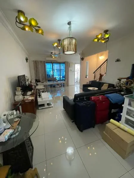 Living features: white painted walls, glossy tile flooring, 5-blade ceiling fan with light, chandelier, sofa in dark grey, coffee table, TV console, wall-mounted TV, decorative wall art, large windows with sheer curtains, open layout to dining area, staircase visible in background, luggage bags, boxes, decorative plants; style: modern.