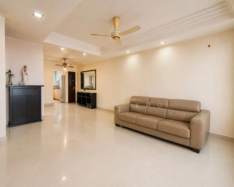 Living features: 3-seater leather sofa in beige, cream painted walls, polished marble flooring, ceiling with recessed downlights, 5-blade ceiling fan, wall-mounted mirror, black console cabinet, decorative statue, open layout to kitchen, neutral color palette; style: modern.