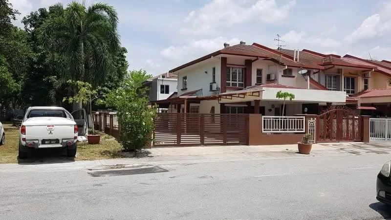 Exterior type: semi-detached house; features: two-storey building, red tiled roof, cream painted facade, wooden fence, manicured lawn, potted plants at entrance, driveway with parking space, front porch, surrounded by greenery; style: modern.