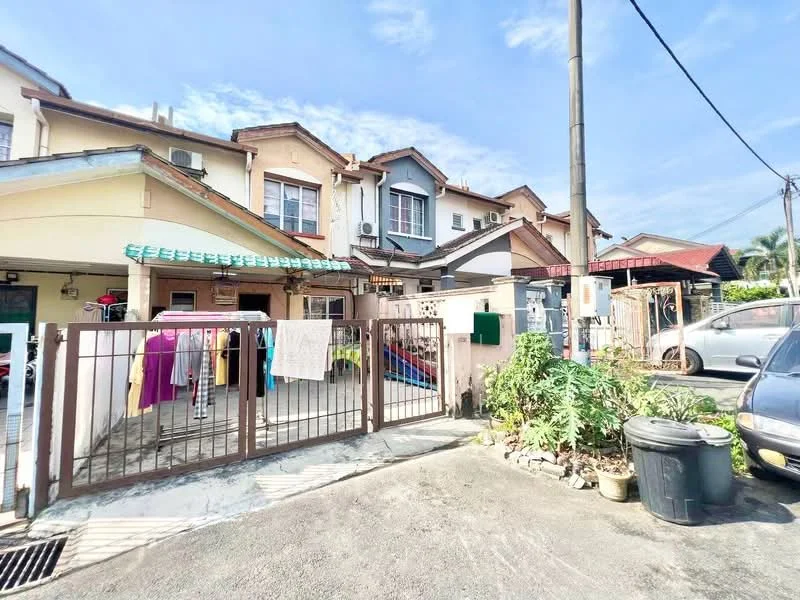 Exterior type: linked terrace house; features: two-storey building, front gate with metal bars, paved driveway, laundry hanging outside, garden area with plants, car parked in driveway, overhead awning, multiple air conditioning units visible, various colored exterior walls, steps leading to entrance; style: modern.