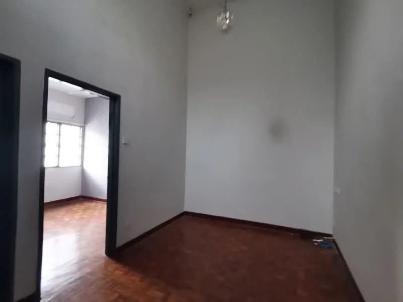 Room features: grey painted walls, wooden flooring, high ceiling, single pendant light, two doorways, large windows, natural light.