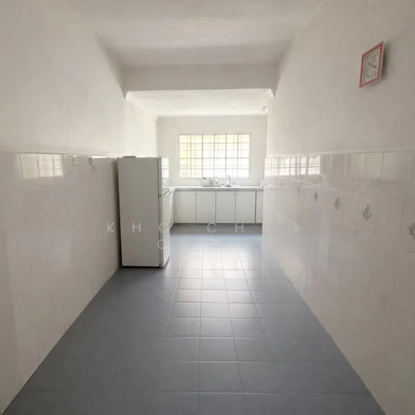 Kitchen features: white painted walls, grey tiled flooring, single-bowl stainless-steel sink, white cabinetry, window with grid pattern, refrigerator, wall clock, countertop, tile backsplash.