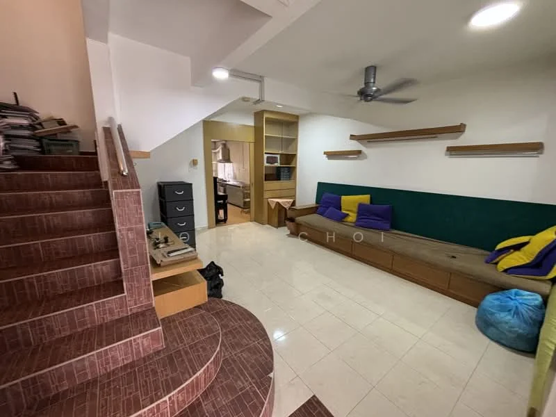 Living features: cream tiled flooring, green accent wall, built-in wooden bench seating, decorative wooden shelves, ceiling fan, bean bag seating, natural light from windows, staircase with tiled steps, open layout to adjacent room; style: modern.