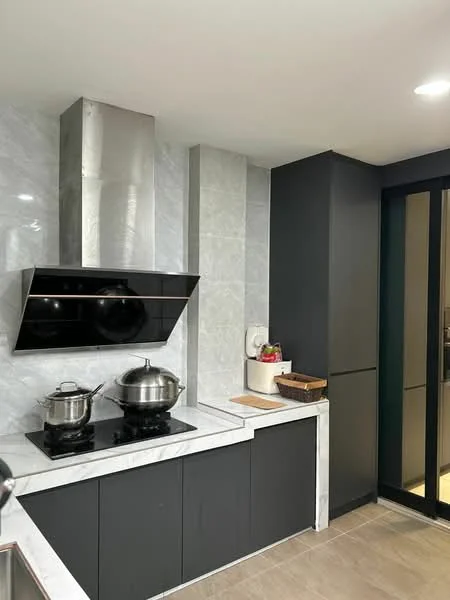 Kitchen features: stainless-steel range hood, black glass backsplash, marble countertop, black cabinetry, built-in stove, ceramic tile flooring, white walls, open shelving, kitchen utensils on countertop; style: modern.
