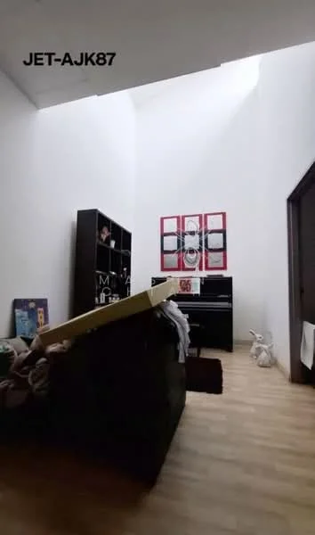 Room features: wooden flooring, white painted walls, high ceiling, black bookshelf, decorative artwork on wall, piano, stuffed toy, small decorative items; style: modern.