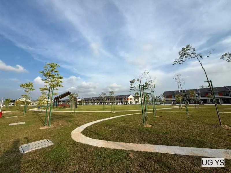 Exterior type: linked terrace house; features: manicured lawn, newly planted trees, paved walkway, open green space, residential buildings in background, clear blue sky, clouds, landscaped area; style: modern.