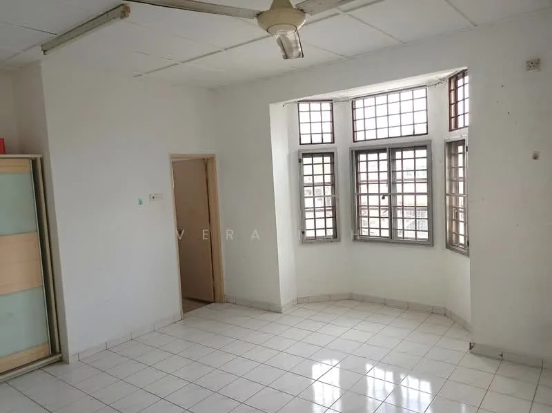 Room features: white painted walls, white tiled flooring, multiple windows with grid design, ceiling fan, corner layout, doorway leading to another room.
