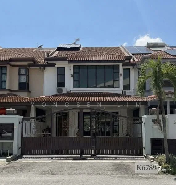 Exterior type: linked terrace house; features: two-storey, brown tiled roof, white painted facade, black wrought iron gate, solar panels on roof, front garden with palm tree, driveway with interlocking pavers, windows with grid pattern, decorative wall features, manicured lawn; style: modern.