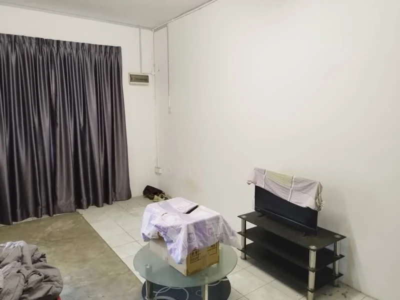 Living features: grey painted walls, concrete flooring, floor-to-ceiling curtains in dark grey, glass coffee table, black TV console, television, box on table, sofa visible in background.