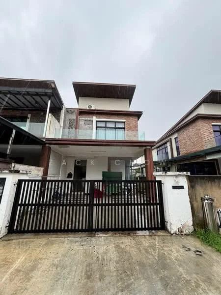 Exterior type: detached bungalow; features: two-storey building, brick facade, balconies on upper floor, glass railing on balcony, flat roof, gated entrance, concrete driveway, manicured lawn, surrounded by greenery; style: modern.