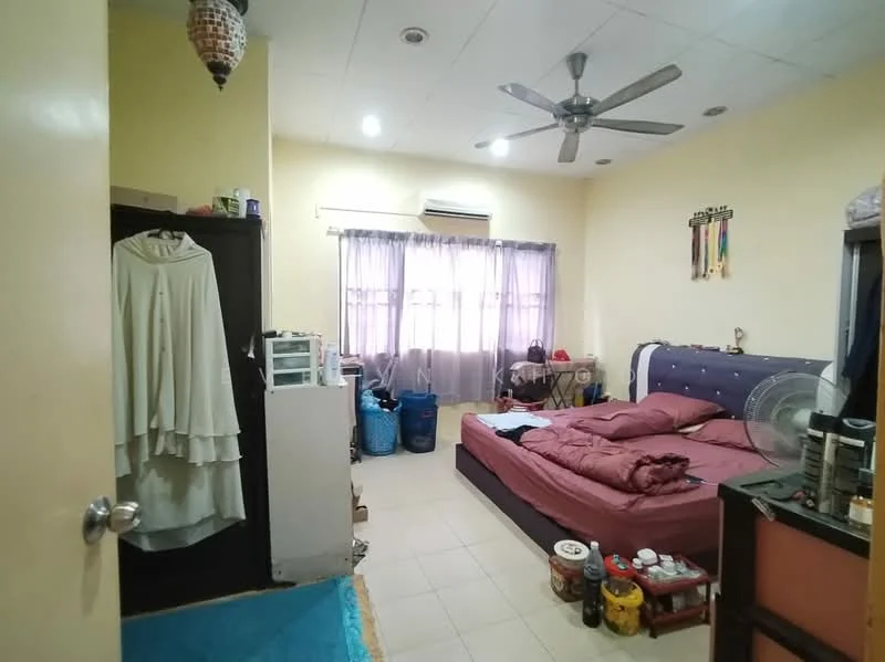 Bedroom features: queen-size bed with maroon bedding, 2 bedside tables, ceiling fan, floor-to-ceiling window with sheer curtains, light-colored walls, tile flooring, built-in wardrobe, decorative wall hangings, various storage boxes, small refrigerator, plastic storage bins, area rug.
