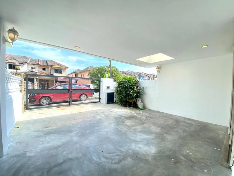 Exterior type: car porch; features: concrete flooring, white painted walls, skylight, outdoor lighting fixtures, landscaped greenery, fenced area, driveway, visible residential buildings in background; style: modern.