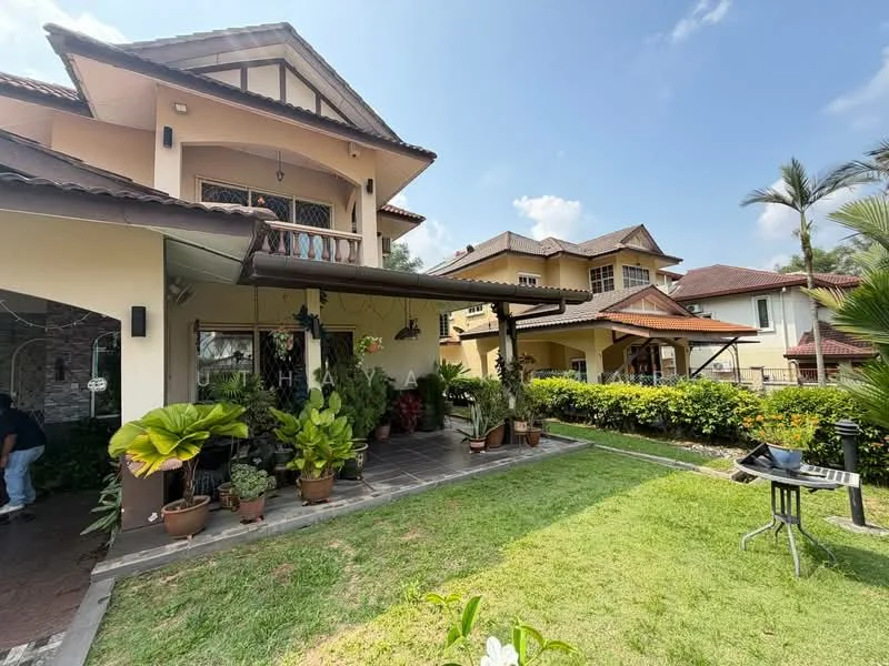 Exterior type: detached bungalow; features: manicured lawn, potted plants, stone-paved walkway, covered porch, sloped roof, multiple storeys, outdoor dining area, garden space, surrounded by greenery, balcony on upper floor, decorative stone facade; style: tropical-modern.