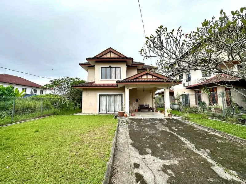 Exterior type: detached bungalow; features: two-storey house, cream painted facade, pitched tile roof, front porch with seating area, manicured lawn, mature trees, driveway with concrete surface, surrounded by greenery; style: modern.