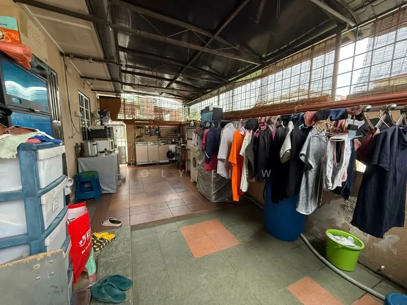 Laundry features: washing machine, dryer, clothes drying rack, tiles flooring in beige and green, metal roof, large windows for natural light, plastic storage bins, sink, clothes hanging on line, open layout.