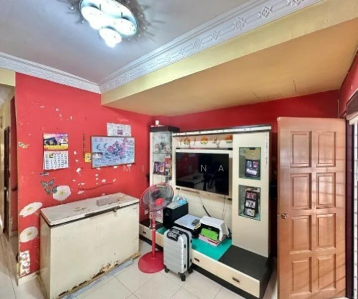 Room features: red painted walls, white ceiling with decorative moulding, tile flooring, built-in wardrobe with mirror, wooden door, ceiling light fixture, fan, decorative wall art, frosted glass window, storage chest, luggage, small table.