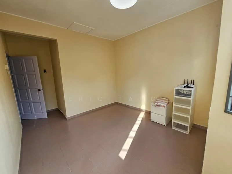Room features: light beige painted walls, brown tiled flooring, ceiling light fixture, window with no treatments, white storage cabinet, small white bedside table, router on top of cabinet, sunlight streaming through window; style: minimalist.