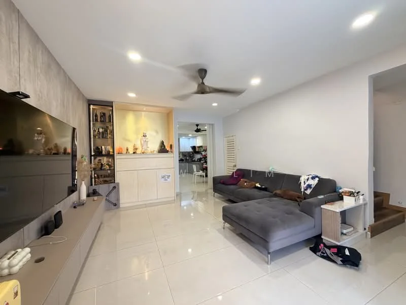 Living features: grey fabric sectional sofa, 3-seater sofa, flat-screen TV mounted on wall, light grey accent wall, white painted walls, recessed LED downlights, ceiling fan, glossy tile flooring, built-in display cabinet with glass doors, decorative items on shelves, open layout to adjacent kitchen, area rug; style: modern.