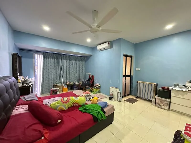Bedroom features: blue painted walls, white ceiling, 5-blade ceiling fan, floor-to-ceiling windows with sheer curtains, sliding glass door, tile flooring, queen-size bed with upholstered headboard, bedding with floral pattern, decorative pillows, built-in wardrobe, dressing table, area rug, wall-mounted air conditioning unit, cluttered with personal items.
