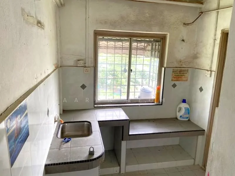 Laundry features: single-bowl stainless-steel sink, grey countertop, white tiled backsplash, white walls, window with metal grille, floor tiles, laundry detergent bottle, wall-mounted shelf; view: garden.