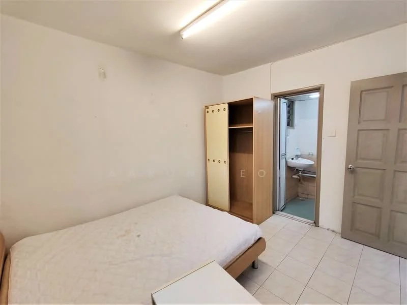 Bedroom features: single bed, wooden bed frame, white mattress, built-in wardrobe with sliding doors, tile flooring, plain white walls, ceiling light fixture, doorway leading to bathroom. Bathroom features: toilet, sink, shower, tile flooring, plain white walls.