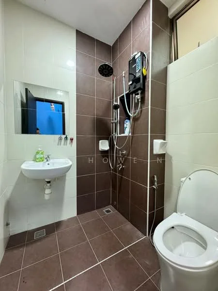 Bathroom features: white ceramic toilet, single-sink vanity with chrome faucet, shower area with wall-mounted showerhead, brown tiled walls, white tiled walls, brown tile flooring, mirror above sink, shower control panel, towel hooks, drainage grate on floor; style: modern.