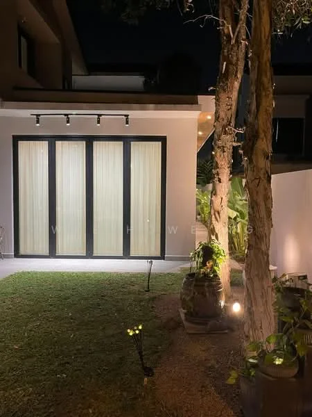 Exterior features: glass sliding doors, vertical sheer curtains, outdoor lighting fixtures, manicured lawn, decorative plants, stone pathway, landscaped garden, trees, modern facade; style: modern.