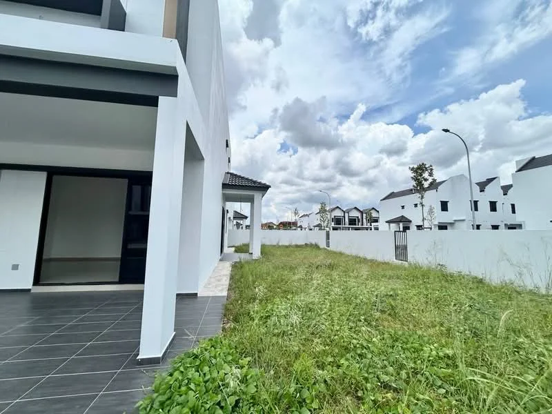 Exterior type: semi-detached house; features: white painted facade, flat roof, manicured lawn, surrounded by greenery, paved walkway, fenced perimeter, open space, two-storey structure; style: modern.