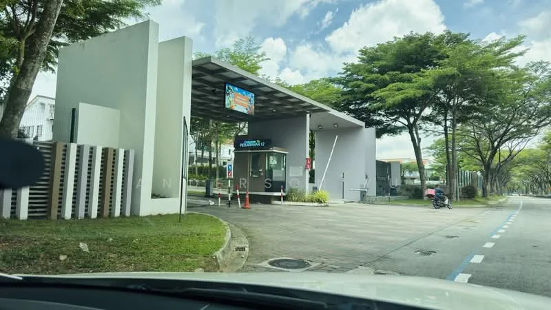 Exterior type: main entrance gate; features: guard house at entrance, security intercom panel, paved driveway, landscaped greenery, canopy roof, digital display board, parking area, surrounded by trees; style: modern.