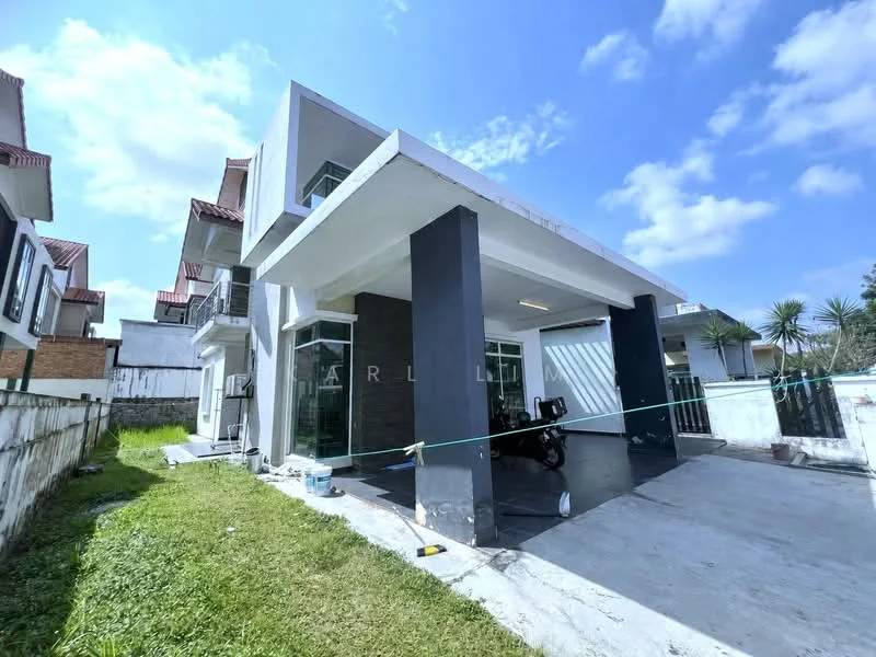 Exterior type: detached bungalow; features: white painted facade, black accent wall, flat roof, approximately 2-storey, manicured lawn, concrete driveway, large windows, covered car porch, surrounded by greenery, fenced perimeter; style: modern.