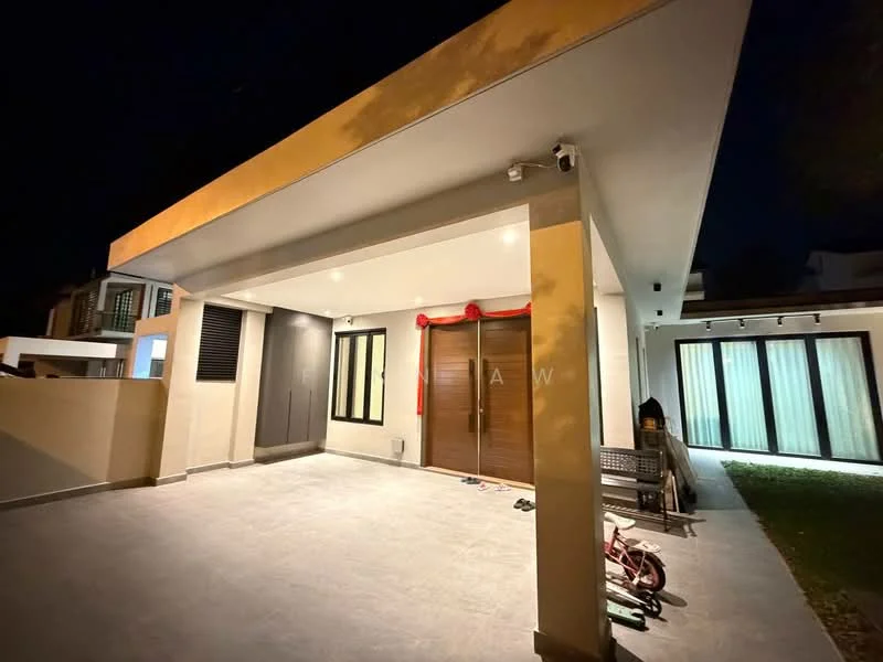 Exterior type: detached bungalow; features: flat roof, cream painted facade, wooden main entrance door, large windows, outdoor lighting, paved driveway, manicured lawn, covered porch area, decorative red ribbon on door; style: modern.