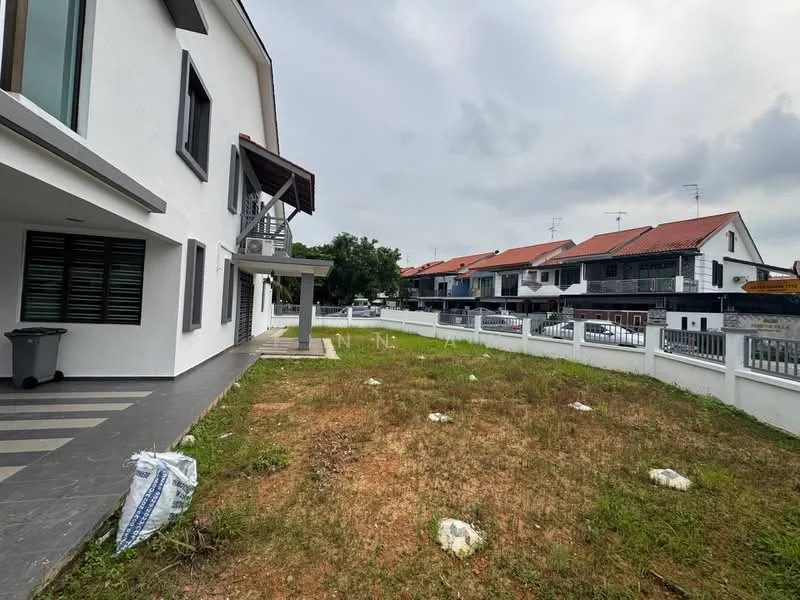 Exterior type: semi-detached house; features: white painted facade, flat roof, manicured lawn, paved walkway, covered porch, surrounded by residential buildings, fenced perimeter, driveway, landscaped garden area; style: modern.