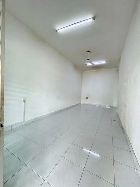 Room features: white painted walls, glossy ceramic tile flooring, ceiling fan, fluorescent ceiling lights, single electrical outlet, no visible furniture or decor; style: minimalist.