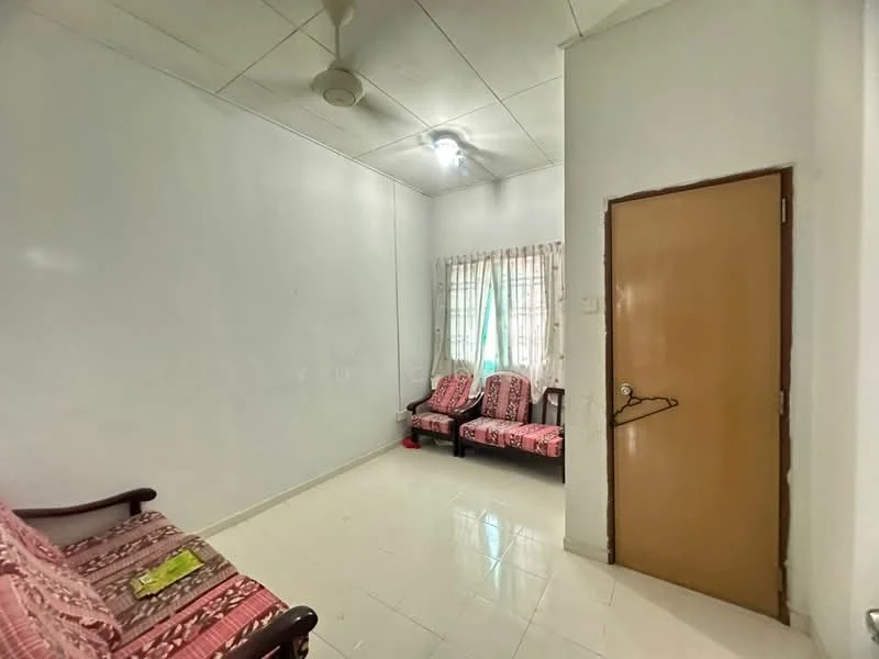 Living features: white painted walls, glossy tile flooring, ceiling fan, two-seater sofa with floral upholstery, two armchairs with floral upholstery, curtains, window with natural light, door leading to another room.