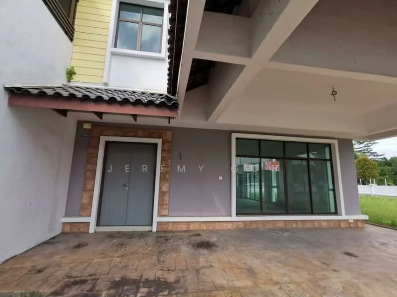 Exterior features: two-storey building, grey painted facade, stone cladding at base, large glass windows, sliding glass door, overhanging roof, decorative eaves, concrete flooring, visible signage on windows; style: modern.
