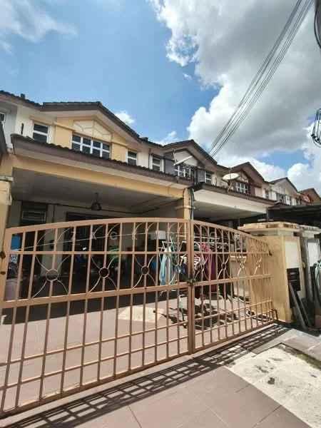 Exterior type: linked terrace house; features: gated entrance, two-storey building, cream and yellow painted facade, tiled roof, front porch area, manicured walkway, visible laundry hanging, surrounded by residential units; style: modern.
