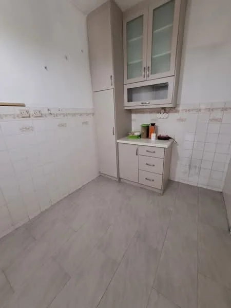 Kitchen features: light grey tiled flooring, white tiled walls, cream cabinetry with glass-front upper cabinets, built-in cupboard, countertop with space for appliances, sink area, kitchen utensils on countertop, no visible appliances; style: modern.