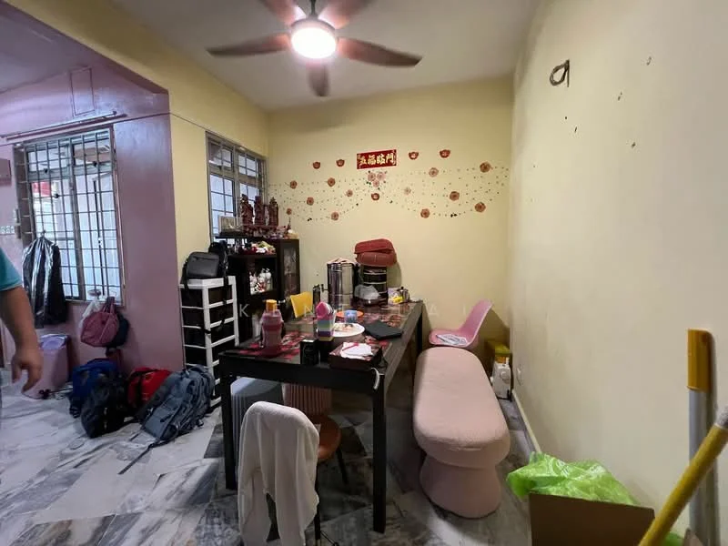 Dining features: round dining table, pink upholstered bench, wooden dining chairs, ceiling fan with light, marble flooring, yellow painted walls, decorative wall stickers, open shelving, various bags and items on the floor.