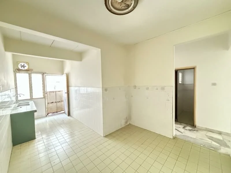 Kitchen features: single-bowl stainless-steel sink, chrome faucet, green countertop, white tiled walls, white tiled backsplash, cream floor tiles, window with wooden frame, door leading outside, doorway to adjacent room.