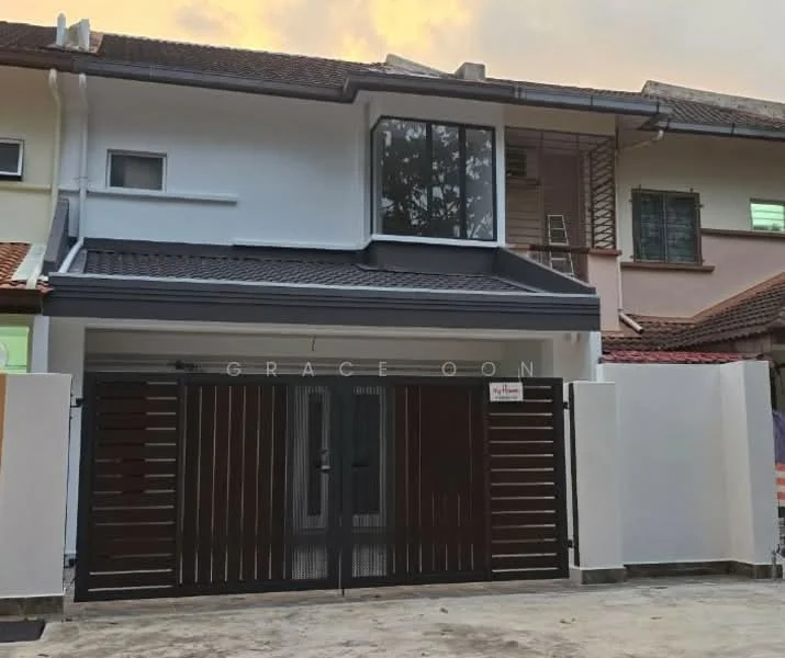 Exterior type: linked terrace house; features: white painted facade, dark wood slatted gate, flat roof with overhang, large window on upper floor, brick driveway, manicured landscaping, surrounded by neighboring houses, security gate, modern architectural design; style: modern.