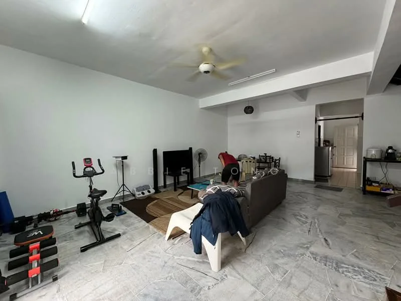 Living features: 5-blade ceiling fan, grey fabric sofa, coffee table, area rug, exercise bike, weight bench, wall-mounted clock, marble flooring, white painted walls, open layout, sliding door to hallway; style: modern.