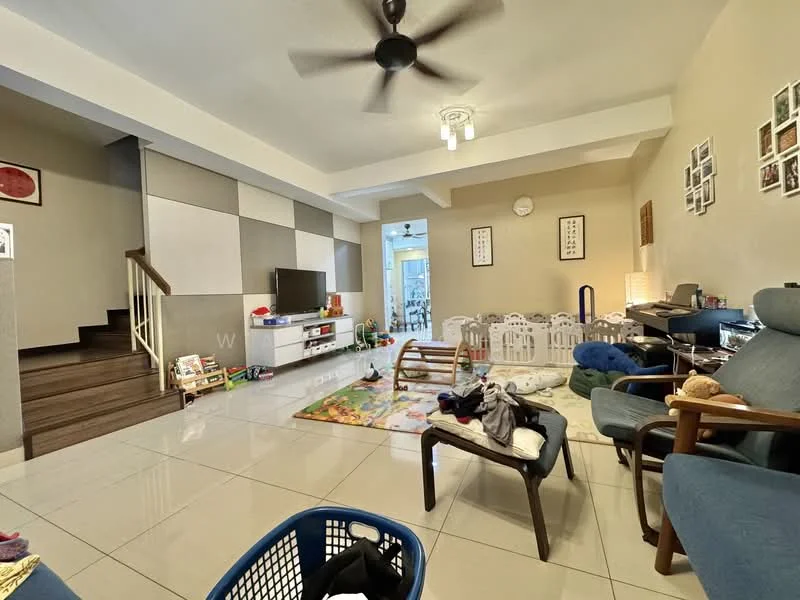 Living features: cream painted walls, grey accent wall, polished tile flooring, 5-blade ceiling fan, wall-mounted TV, TV console, area rug with geometric pattern, sofa in blue fabric, coffee table, decorative wall frames, staircase leading to upper floor, children's play area with playmat; style: modern.