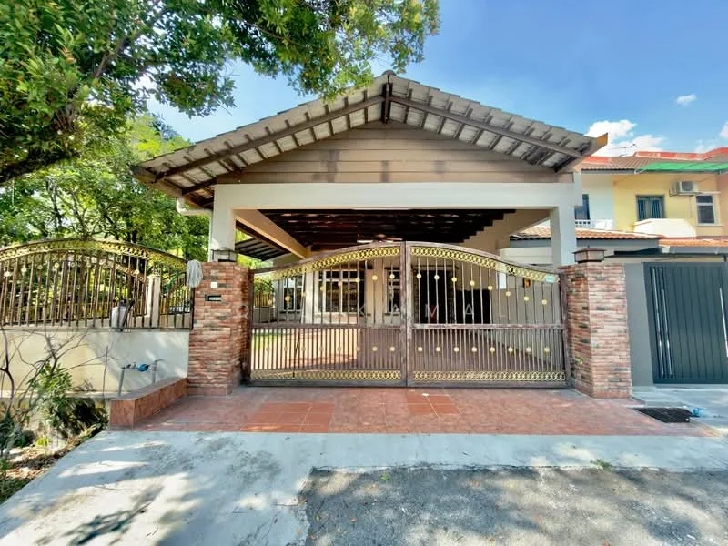 Exterior type: detached bungalow; features: gabled roof, wooden beams, brick facade, metal gate, paved driveway, landscaped garden, surrounding trees, porch area, front fence, outdoor lighting; style: modern.