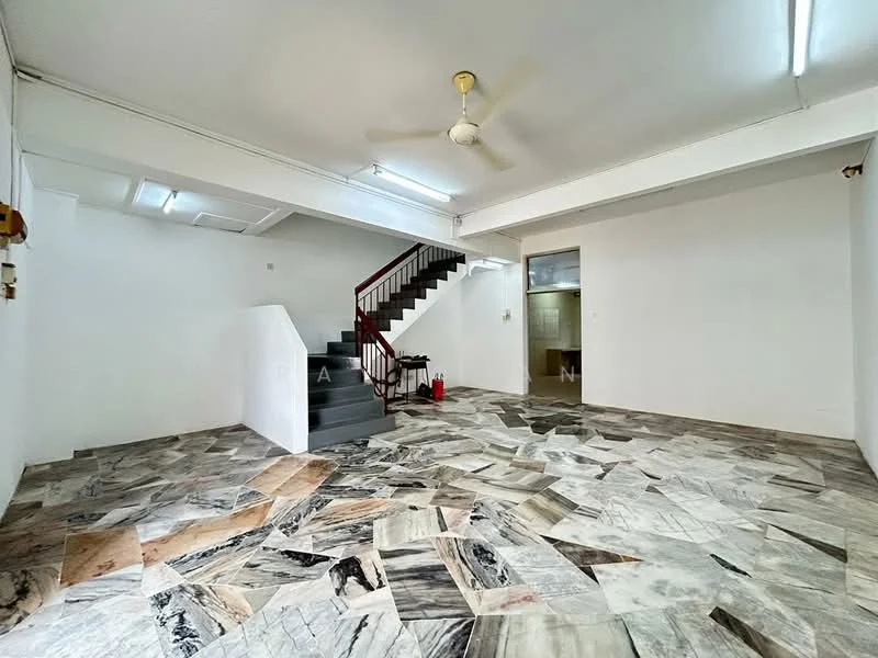 Living features: marble flooring, white painted walls, ceiling fan, staircase with red railing, open layout, large windows, fire extinguisher, utility area visible in background.